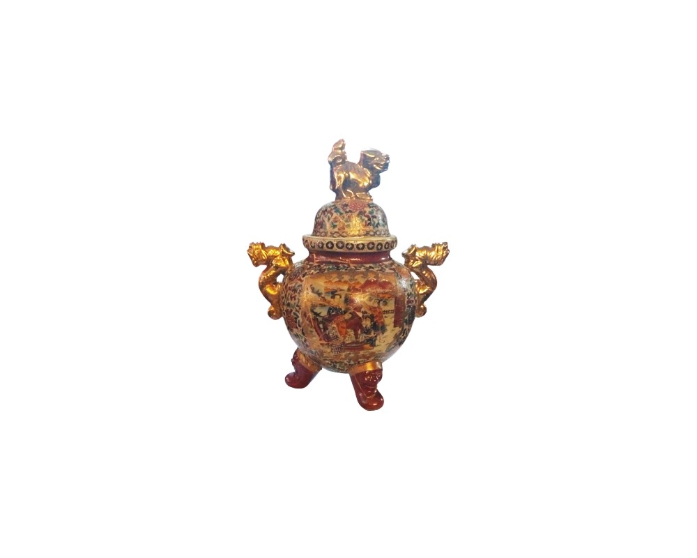 Decorative ceramic or porcelain incense burner in an oriental style, richly decorated with multicoloured and gold details; available for hire for events, advertising, films and TV series
