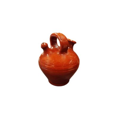Traditional ceramic water jug characterised by a globular body with subtle ridges on the shoulders, a narrow base, an upper bridge-style handle, a spout and a side pouring opening; available for hire for events, advertising, films and TV series