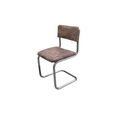 A vintage side chair with a modern design, characterised by a continuous cantilevered tubular metal frame (cantilever) with a chrome finish, and a seat and separate backrest, both upholstered in fabric with a distinctive retro pattern in shades of brown and beige; available for hire for events, advertising, films and TV series