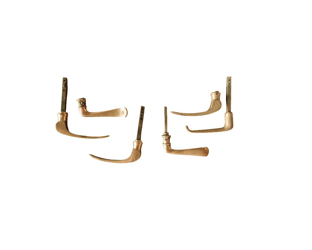 A lot comprising a set of vintage door handles, dating from around the 1950s and made of solid brass; available for hire for events, advertising, films and TV series