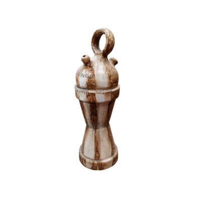 A ceramic jug with a slender, elongated design, comprising a pedestal-style body that widens at the base and is topped by a globular upper section with a circular handle, spout and side opening; available for hire for events, advertising, films and TV series