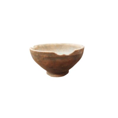 A small traditional ceramic bowl characterised by a globular body resting on a distinct ring-shaped base, in dark earthy tones; available for hire for events, advertising, films and TV series