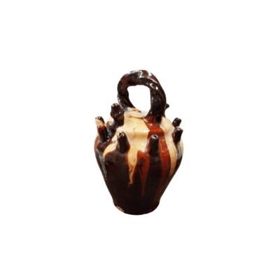 a ceramic jug with a globular body and narrow base, featuring an upper bridge-style handle and a rim with multiple spouts arranged along its shoulder; available for hire for events, advertising, films and TV series