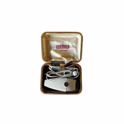 A classic electric razor from the prestigious Schick brand, the ‘Colonel’ model, dating from around the 1950s, available for hire for events, advertising, films and TV series