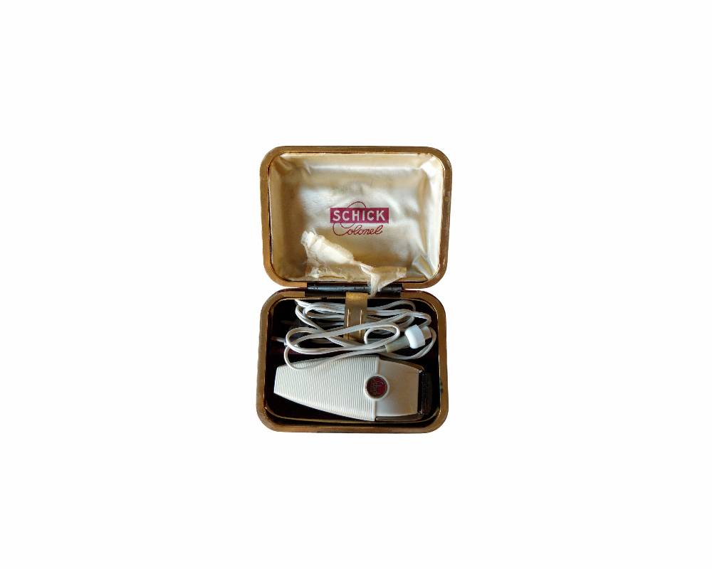 A classic electric razor from the prestigious Schick brand, the ‘Colonel’ model, dating from around the 1950s, available for hire for events, advertising, films and TV series