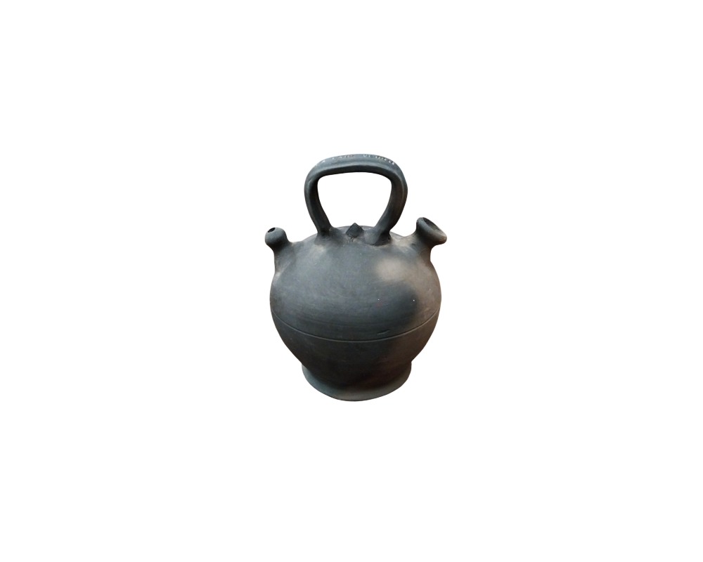 A traditional ceramic water jug characterised by a globular body resting on a pedestal base and a dark, matt ‘bucaro’-style finish; available for hire for events, advertising, films and TV series