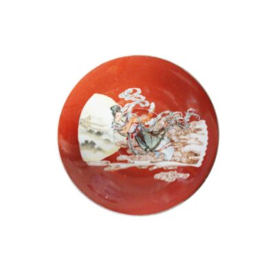 A ceramic plate characterised by a rich terracotta-coloured glaze on both the outside and inside; available for hire for events, advertising, films and TV series