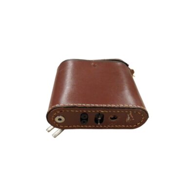 A small brown leather case or protective cover with visible stitching, featuring a metal plate on the base incorporating terminals, adjustment screws and technical connectors; available for hire for events, advertising, films and TV series
