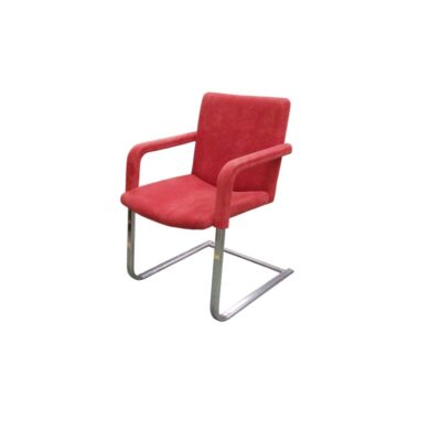Vintage side chair with a modern design, characterised by a continuous cantilevered tubular metal frame with a chrome finish, and a padded seat, backrest and armrests upholstered in bright red fabric; available for hire for events, advertising, films and TV series