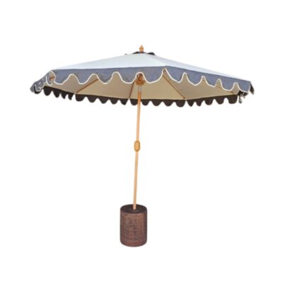 A classic-style outdoor parasol, characterised by its light-coloured canopy with a striking contrasting skirt featuring wavy edges and light-coloured piping; available for hire for events, advertising, films and TV series