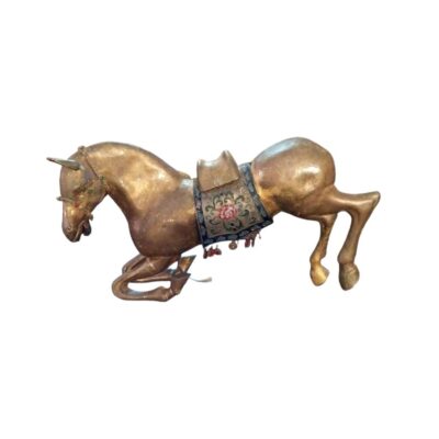 Decorative sculpture depicting a horse in a dynamic, kneeling pose, finished in aged gold tones; available for hire for events, advertising, films and TV series