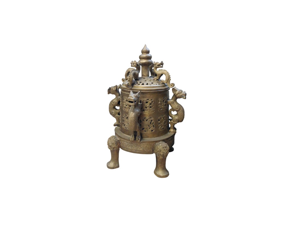 A cylindrical metal censer with a golden patina, featuring intricate relief carvings of mythological creatures or dragons on the sides and lid, and resting on three sturdy, ornate legs; available for hire for events, advertising, films and TV series
