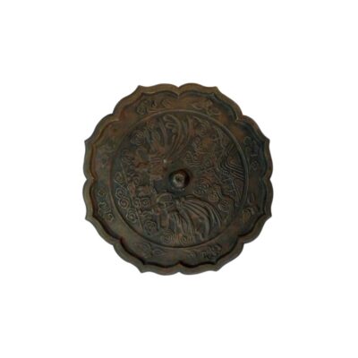 Antique bronze mirror with a distinctive lobed edge and a distressed finish in dark tones; available for hire for events, advertising, films and TV series