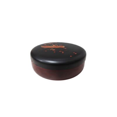 A small, round box with a domed body in shades of red and brown, featuring a flat top lid with rounded edges and a dark-coloured lacquered finish; available for hire for events, advertising, films and TV series