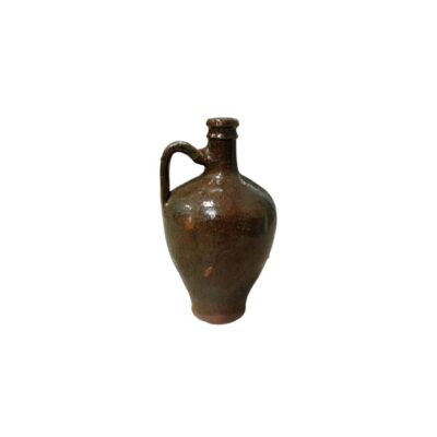 ceramic jug with a glossy glazed finish in dark and brown tones, characterised by a bulbous body, a narrow base, a short neck and a practical side handle; available for hire for events, advertising, films and TV series