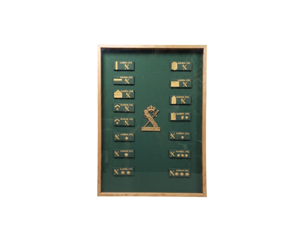 Decorative display case with a wooden frame and green velvet backing, featuring a neatly arranged collection of all the insignia and emblems used by the Civil Guard, alongside the institution’s central emblem; available for hire for events, advertising, films and TV series