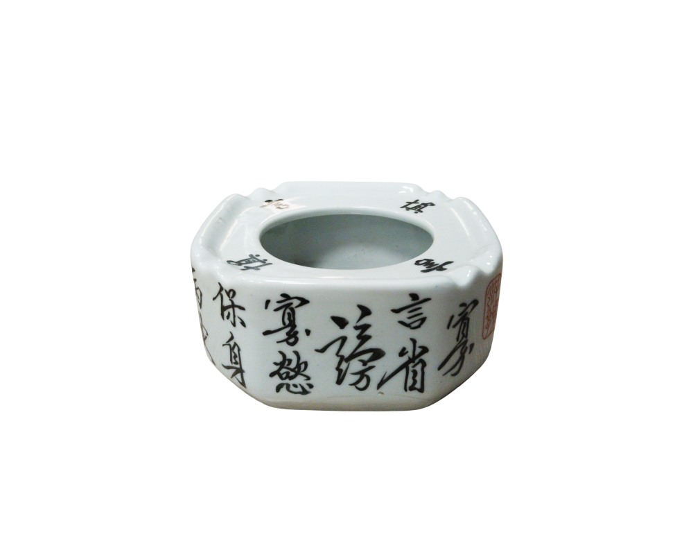 Square ceramic ashtray with rounded corners and fluted upper edges, finished in a glossy white glaze; available for hire for events, advertising, films and TV series