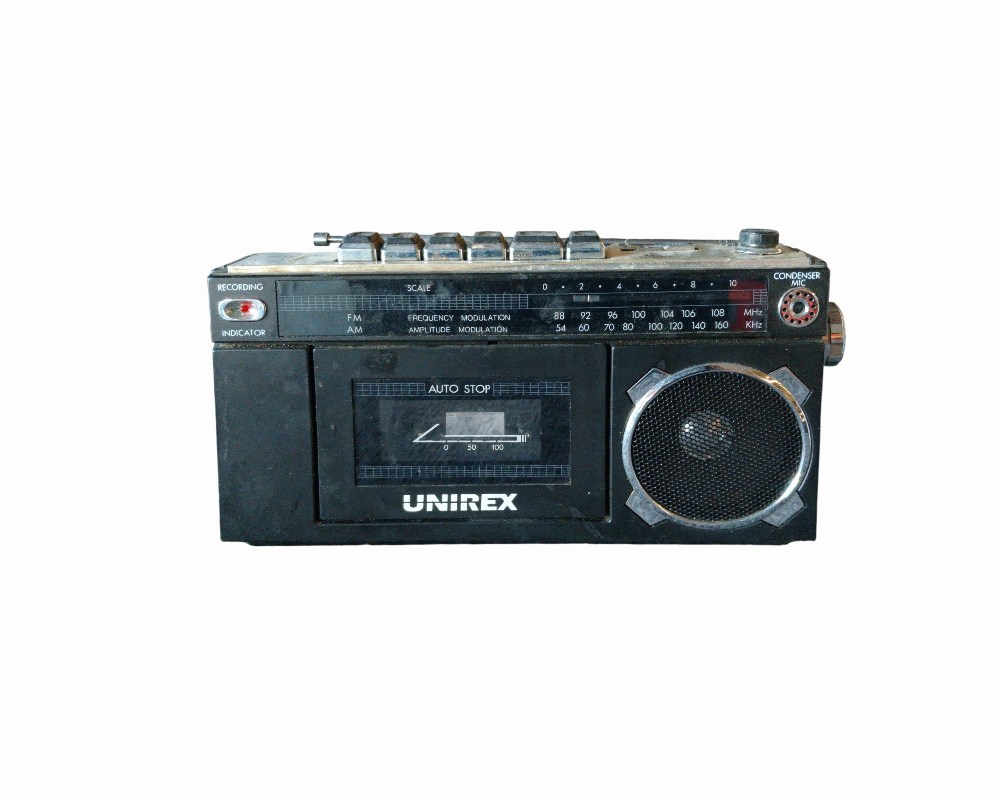 Classic portable Unirex cassette radio, designed for analogue audio playback and tuning into AM/FM radio stations; available for hire for events, advertising, films and TV series