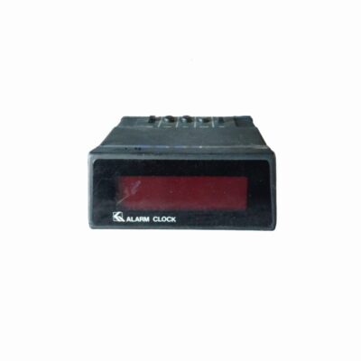 Classic vintage digital table alarm clock with a red LED display, characteristic of the electronic aesthetic of the 1970s and 1980s; available for hire for events, advertising, films and TV series
