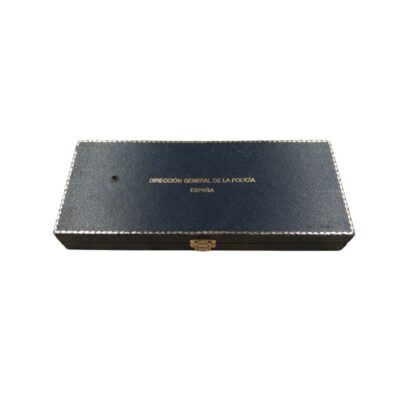 An elongated rectangular case in navy blue with a metal clasp, featuring the institutional text ‘DIRECCIÓN GENERAL DE LA POLICÍA ESPAÑA’ printed in gold on the lid and an ornate border; available for hire for events, advertising, films and TV series