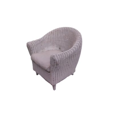 A cosy vintage side chair, made entirely from a wraparound frame of natural wicker and rattan in a white shade; available for hire for events, advertising, films and TV series