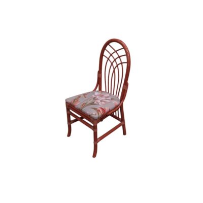 Vintage side chair with a bamboo frame and wicker-reinforced joints, characterised by a distinctive oval backrest with vertical rods arranged in a fan shape and a comfortable, padded seat cushion upholstered in fabric with a classic floral print. Available for hire for events, advertising, films and TV series