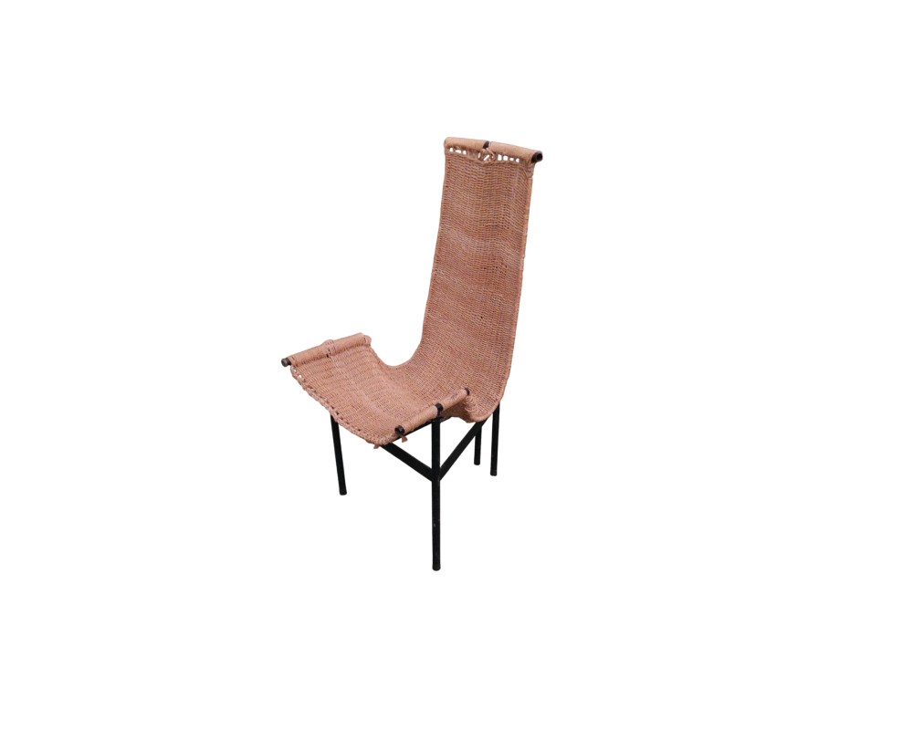 A modern vintage side chair, characterised by a seamless, ergonomic body, upholstered or covered in esparto grass; available for hire for events, advertising, films and TV series