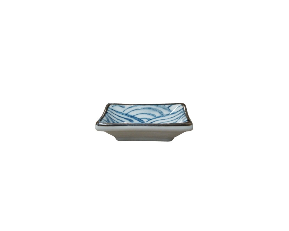 A small square ceramic plate with slightly raised edges and a dark rim, decorated on the inside with a traditional design of waves or curved lines in shades of blue against a light background; available for hire for events, advertising, films and TV series