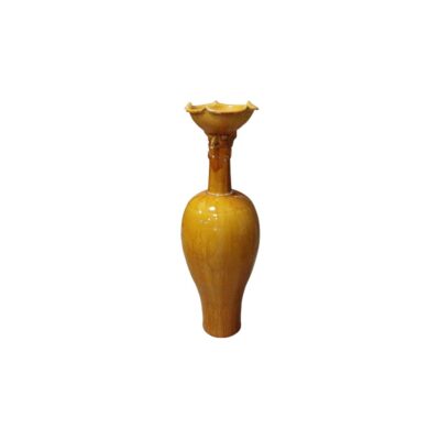 Ceramic vase with a glossy finish in shades of yellow, characterised by a slender body with delicate floral engravings in relief, a slender neck decorated with a zoomorphic figure, and a rim with a lobed or flower-shaped edge; available for hire for events, advertising, films and TV series