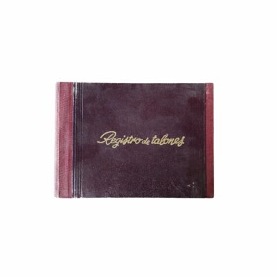 A set of two vintage account books from the mid-20th century, designed for administrative and commercial management. It includes a ‘Cheque Register’ volume bound in burgundy with gold lettering, and a ‘Revenue and Payments Register’ notebook for event hire, advertising, films and TV series.