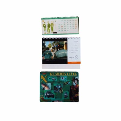 Vintage institutional merchandise from the Civil Guard, comprising two spiral-bound desk calendars featuring illustrations and operational photographs of the Civil Guard; available for hire for events, advertising, films and TV series