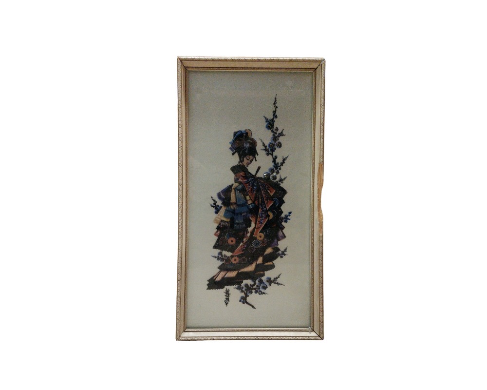 A framed artwork with a vertical rectangular design, featuring a three-dimensional or relief depiction of a traditional female figure in elaborate attire, accompanied by floral motifs; available for hire for events, advertising, films and TV series