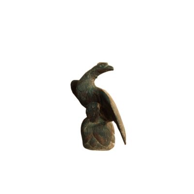 A small relief or full-round sculpture depicting a bird with plumage rendered in detail through incisions, characterised by a finish in dark, greenish tones with an aged patina; available for hire for events, advertising, films and TV series