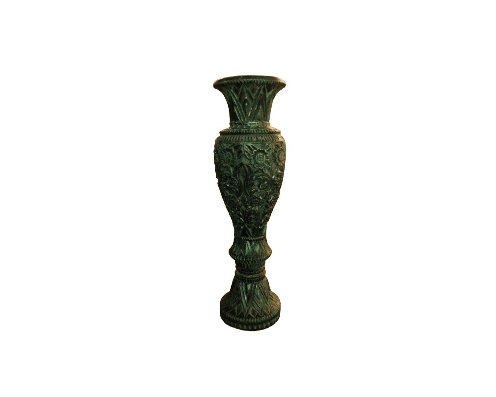A decorative vase with a stylised design, characterised by intricate carvings featuring floral and geometric motifs along its body, neck and base, complemented by an aged patina finish in dark tones. Available for hire for events, advertising, films and TV series.