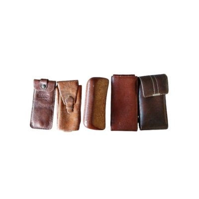 A batch of vintage cases and pouches made from leather, hide and rigid lined materials, traditionally used to protect rental glasses for events, advertising, films and TV series