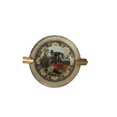 Decorative circular ashtray with scalloped edges and two built-in side holders for cigarettes; available for hire for events, advertising, films and TV series