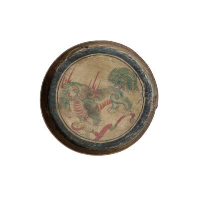 A circular wooden tray, featuring an interior surface decorated with an artistic depiction of a traditional mythological creature in shades of green and red, surrounded by a dark circular border; available for hire for events, advertising, films and TV series