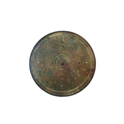 Circular metal mirror with an aged patina and a richly ornamented design on its surface; available for hire for events, advertising, films and TV series