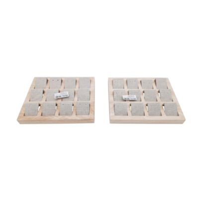 This set comprises two square display trays with a light-coloured wooden outer frame and multiple individual compartments lined with textured linen fabric; available for hire for events, advertising, films and TV series