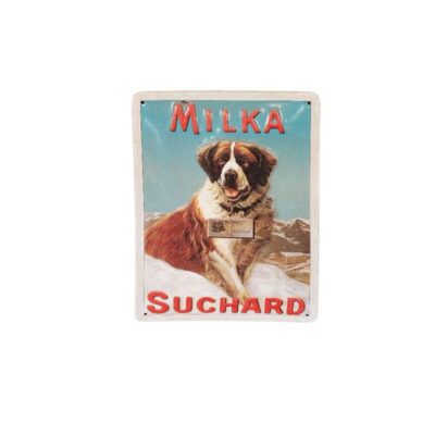 A rectangular, portrait-format sign featuring a nostalgic illustration of a St Bernard dog against a snowy Alpine backdrop, flanked by the brand names ‘MILKA’ at the top and ‘SUCHARD’ at the bottom. Available for hire for events, advertising, films and TV series