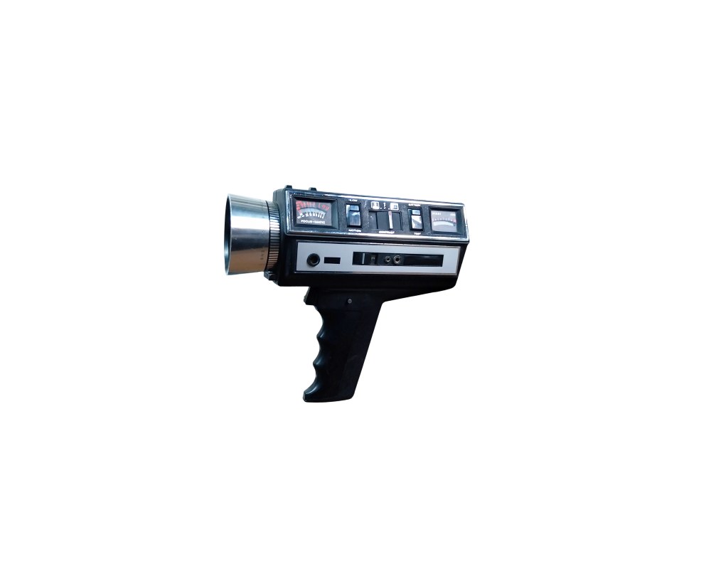 Vintage analogue film camera, characterised by its compact body in dark colours with top-mounted controls, indicator panels and an ergonomic vertical grip; available for hire for events, advertising, films and TV series