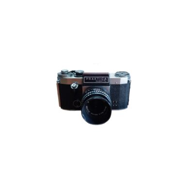 A vintage analogue SLR camera with a metal body and textured black finish, based on the iconic Praktica Super TL model, fitted with its original front lens; available for hire for events, advertising, films and TV series