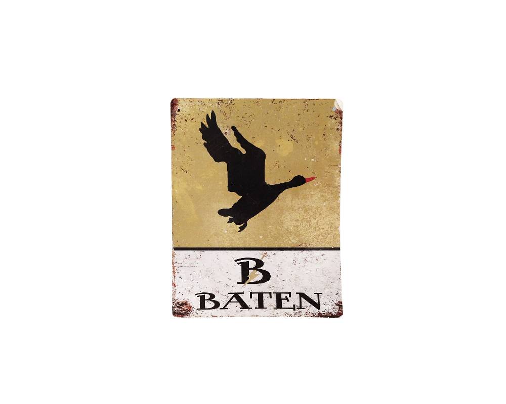 A rectangular, portrait-oriented plaque with an aged finish, featuring the silhouette of a bird with a reddish beak in flight against a light-coloured background, and the inscription ‘B BATEN’ at the bottom. Available for hire for events, advertising, films and TV series.