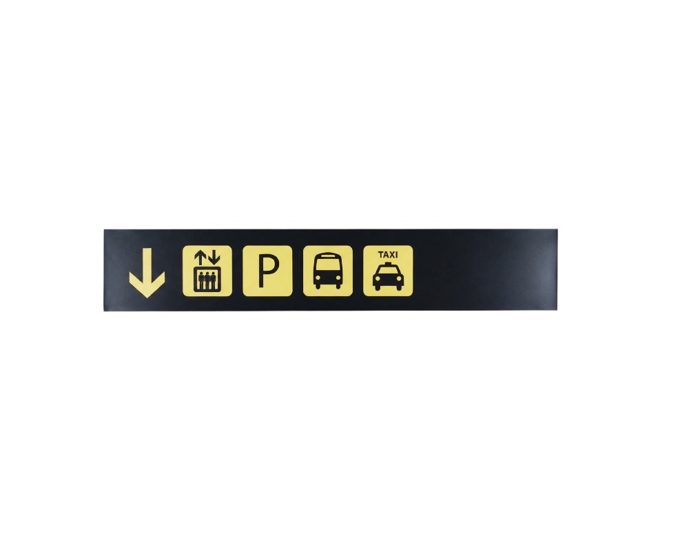 letrero rectangular de formato horizontal con fondo oscuro que incluye una flecha direccional hacia abajo y una secuencia de pictogramas en recuadros claros que señalizan el acceso a ascensor, aparcamiento (P), autobús y servicio de taxi alquiler para eventos, publicidad, peliculas y series
