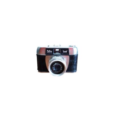 A Halina Paulette analogue camera with a classic design featuring a black-coated body and silver metallic details, with its central lens and built-in viewfinder standing out; available for hire for events, advertising, films and TV series