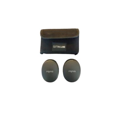 Signia brand hearing technology components, comprising two small, dark-coloured, oval-shaped devices or cases bearing the printed logo, and a technical fabric carrying case with a flap and a front label bearing the inscription ‘Cutting Line’ – available for hire for events, films and TV series