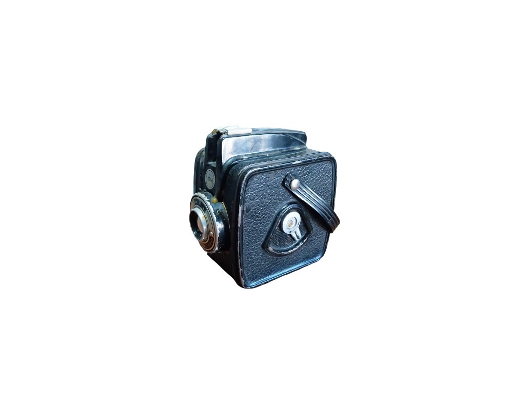 Vintage black box camera, characterised by its compact, cubic design with a textured finish, side-mounted lens and an integrated carrying strap; available for hire for events, advertising, films and TV series