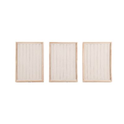 Set of three rectangular display trays, with a light-coloured wooden frame and an interior entirely lined with vertical slats covered in textured linen fabric; available for hire for events, advertising, films and TV series