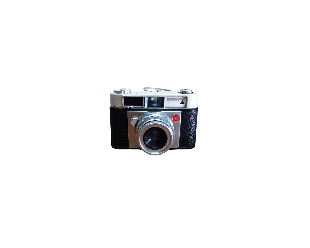 A classic analogue camera, characterised by its two-tone design with a dark textured body and a light-coloured upper section, a built-in viewfinder and a prominent metal front lens with circular detailing; available for hire for events, advertising, films and TV series