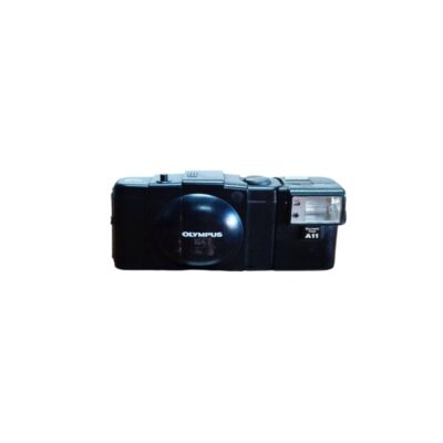 An Olympus XA1 compact analogue camera, accompanied by its A11 attachable electronic flash unit, characterised by its sleek black body and integrated sliding protective cover; available for hire for events, advertising, films and TV series